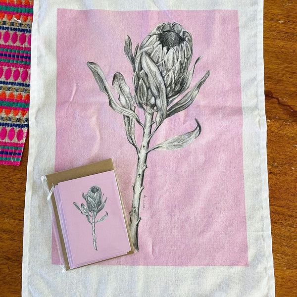 Protea art pink tea towel & pink card set. Floral graphite drawing artwork on 100% cotton and matching card