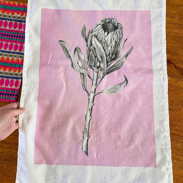 Protea art pink tea towel & pink card set. Floral graphite drawing artwork on 100% cotton and matching card